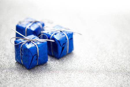 Three blue gift boxes for Christmas decorationの写真素材