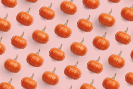Orange pumpkin pattern on pastel color backgroundの写真素材