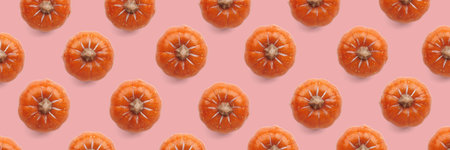 Orange pumpkin pattern on pastel color background