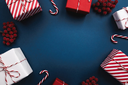 A beautiful arrangement forms a circle of colorful Christmas presents, delightful candy canes, and...