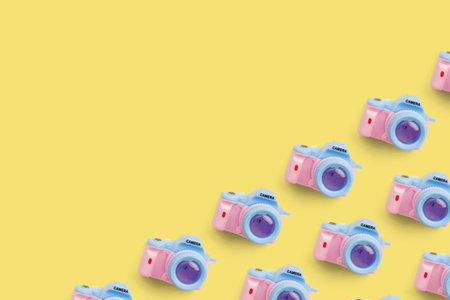Pattern with camera on pastel color background, top viewの写真素材