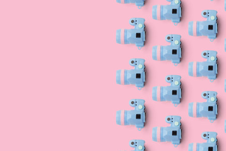 Pattern with camera on pastel color background, top viewの写真素材