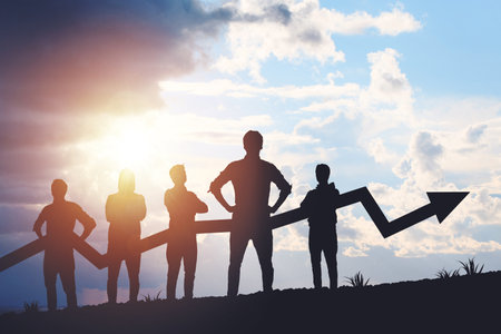 Team silhouette and up graph arrow on sunset background, leadership and teamwork concept.の写真素材