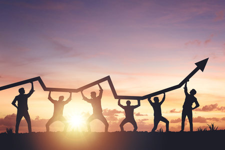 Team silhouette and up graph arrow on sunset background, leadership and teamwork concept.の写真素材