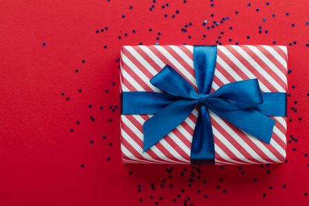 Gift box on color background, flat lay, space for textの写真素材