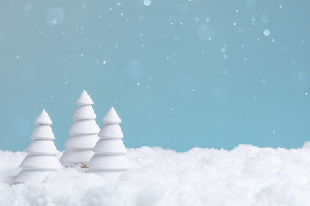 minimalist winter landscape with snow, serene snowy scene with gentle snowfall and blue skyの写真素材