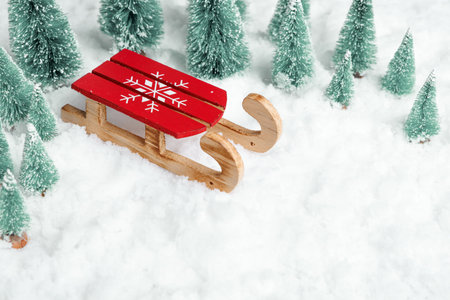 nostalgic winter scene with sled, vintage snowcovered sled and frosted trees conjure holiday