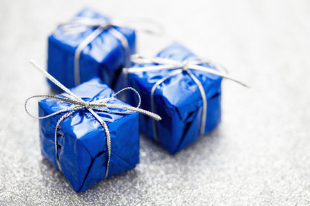 Three blue gift boxes for Christmas decorationの写真素材