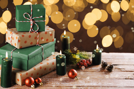 Christmas gift boxes with decoration on the tableの写真素材