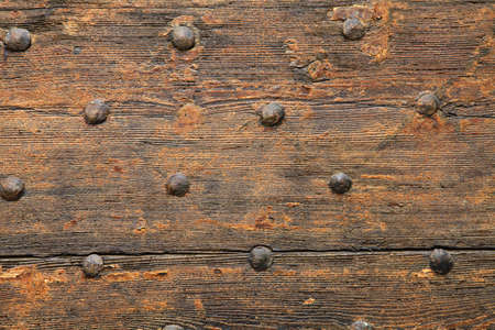 Fragment of a wooden antique door with iron ornaments  Pavia, Italy 