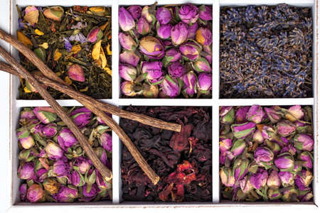 Assortment of dry herbs tea in a wooden box.の写真素材