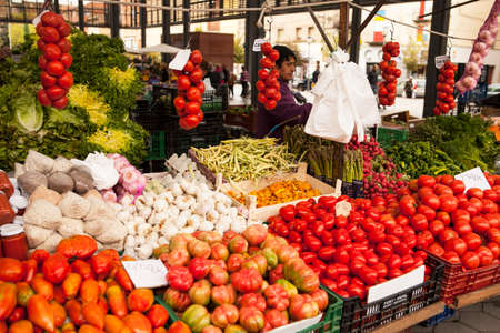 FIGUERES, SPAIN - OCTOBER 12, 2016: fruit and vegetables for sale at Figueres. Colorful food and flowers market which is popular with locals and tourists.のeditorial素材
