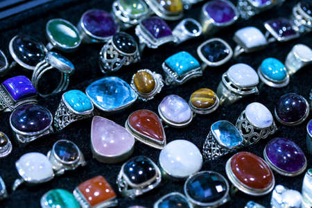 Colorful gems stone rings in a mineral marketの写真素材