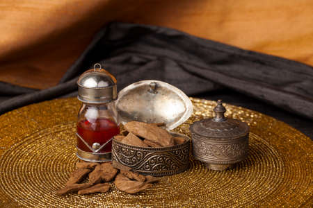 Agarwood, also called aloeswood, essential oil and incense chipsの写真素材