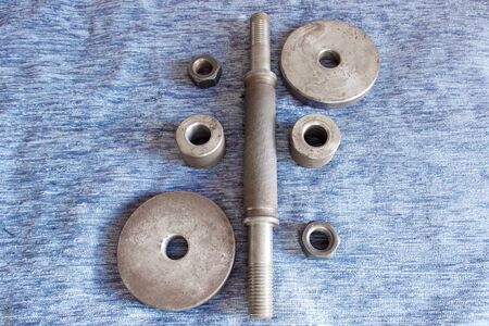 Disassembled metal dumbbell on the tableの写真素材