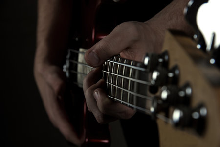 Guitar in hands close-up. Strings. Guitar neck. Music