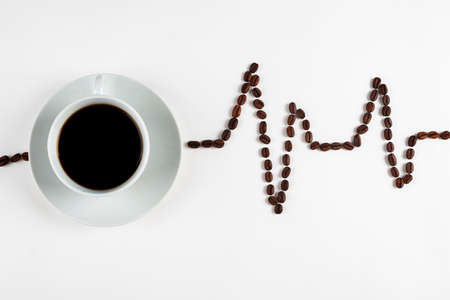 Heart pulse from coffee in a white cup. Grain. Morning. Healthの写真素材