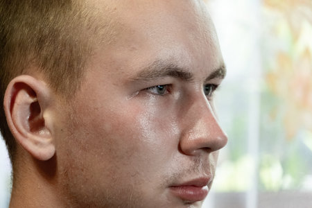 Portrait of a young man at home