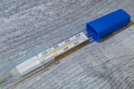 This is a modern Digital Thermometer that comes equipped with a Protective Cap for safetyの写真素材