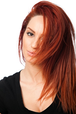 portrait of a beautiful young red head woman, on white backgroundの写真素材