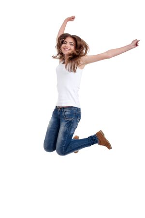 happy teen girl jumping, isolated on white backgroundの写真素材