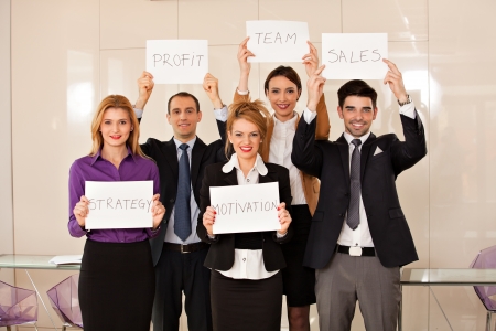team of young business people holding cardboards  strategy, motivation, profit, team, salesの写真素材