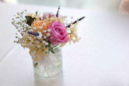 Beautiful flower bouquet of roses on a tableの写真素材