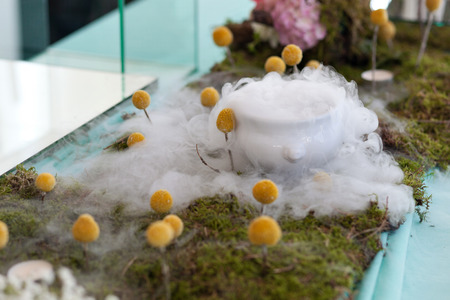 Flower arrangement with steam and yellow flowersの写真素材