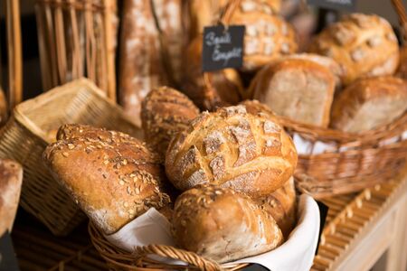 baskets of bread on a shelf, in a bakery store
