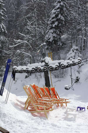 Deck chairs in the snowの写真素材