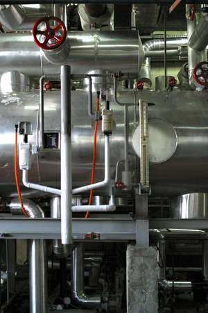 red valve with ice and stainless steel pipesの写真素材