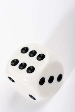 white dice on pale backgroundの写真素材