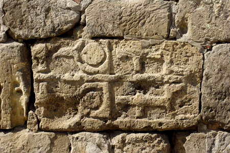 old stone inscription and symbolsの写真素材