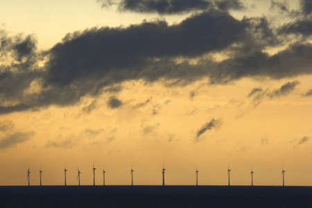 offshore windfarm at sunsetの写真素材