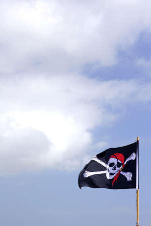 pirate flag blue skyの写真素材