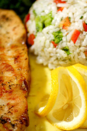 grilled chicken breast with rice and lemon sauceの写真素材