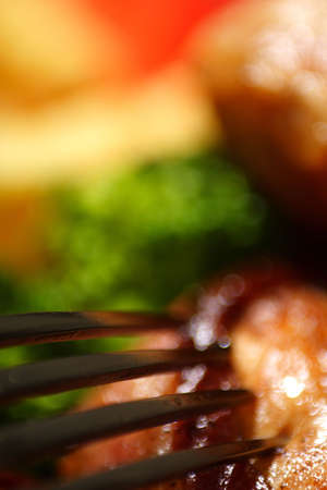 turkey medallion stuffed with kymac cheese and bacon served with french fries  and green vegtablesの写真素材