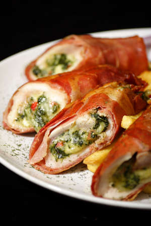 chicken breast stuffed with broccoli and cheese wrapped with baconの写真素材