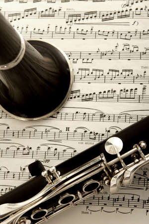 close up photograph of clarinet and sheet music