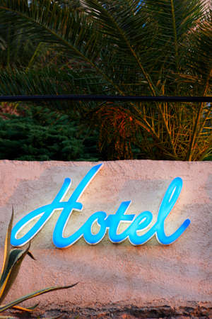 blue hotel sign on wall, corsica, franceの写真素材