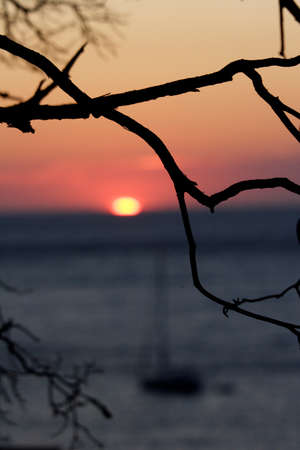 atmospheric image of yacht anchored at sunset, Corsica, Franceの写真素材