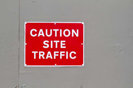 red and white caution site traffic warning signの写真素材