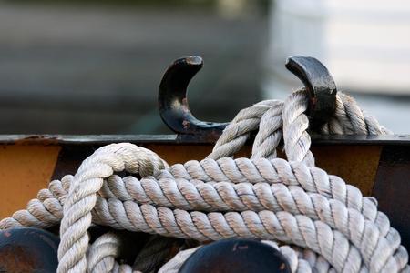 The boat is moored by a rope の写真素材