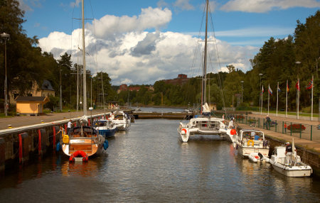 Pleasure boatsin Sodertalje canal locks in Sodertaljee from the Baltic to the lake M?ren.のeditorial素材