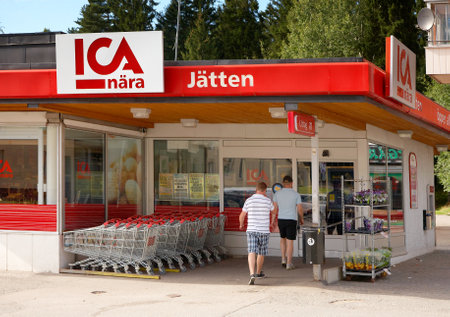 Grocery ICA N? - J?en in Soderalje, Sweden, with customers who walk through the entrance.のeditorial素材