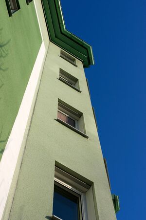 The green facade striving upwards towards the blue sky  の写真素材