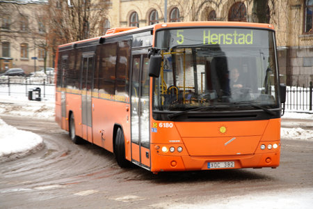 Karlstad, Sweden - December 16, 2012: Local bus on Line 5 with destination Henstad turns into Tingvalla street from Eastern Torggatan in Karlstad city center.  のeditorial素材