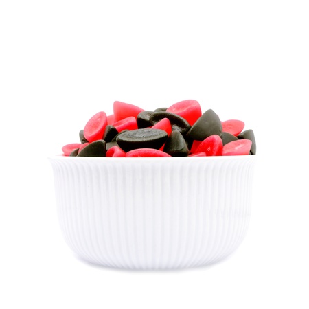 A bowl of licorice and raspberry boats の写真素材