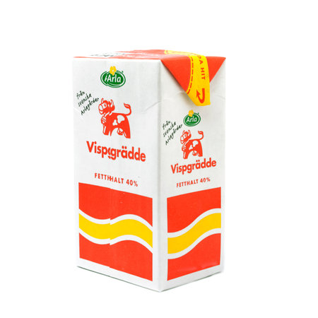A pack for the Swedish market of 3 deciliter unwhipped whipping cream 40% from Arla isolated on white background.のeditorial素材