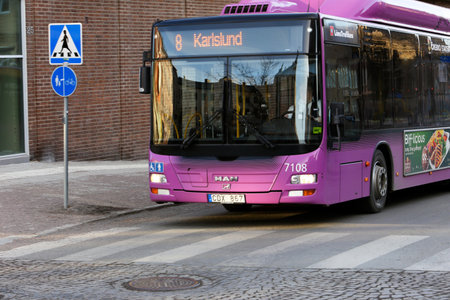 Orebro, Sweden - March 7, 2013: City bus on line 8 with destination Karlslund at the crosswalkのeditorial素材